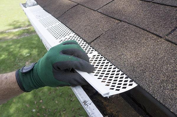 gutter guards are designed to allow water to flow into the gutter while blocking leaves and other debris from entering